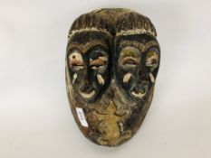 AN ETHNIC HAND CARVED WOODEN TRIBAL MASK DEPICTING A DOUBLE FACE AND LIZZARDS H 28CM.