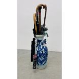 A MODERN CHINESE BLUE AND WHITE VASE, NOW USED AS A STICKSTAND,