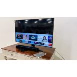 SAMSUNG 55 INCH TV MODEL UE55RU7400U AND REMOTE CONTROL ALONG WITH A SAMSUNG SOUND BAR AND REMOTE