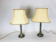 A PAIR OF STEEL BASED TABLE LAMPS - SOLD AS SEEN.