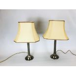 A PAIR OF STEEL BASED TABLE LAMPS - SOLD AS SEEN.