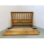 A HONEY PINE DOUBLE BEDFRAME.