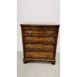 A REPRODUCTION BURR WALNUT FINISH FOUR DRAWER CHEST WITH BRUSHING SLIDE AND BRACKET FEET. W 61CM.
