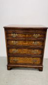 A REPRODUCTION BURR WALNUT FINISH FOUR DRAWER CHEST WITH BRUSHING SLIDE AND BRACKET FEET. W 61CM.