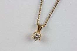 A DIAMOND SOLITAIRE (4.6MM) PENDANT IN A YELLOW METAL SETTING ON A FINE 9CT GOLD CHAIN, L 50CM.