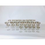 A SET OF GILT RIMMED DRINKING GLASSES, APPROXIMATELY 35.