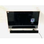 LG 42" FLAT SCREEN TV WITH REMOTE AND A CELSUS SOUND BAR - SOLD AS SEEN.