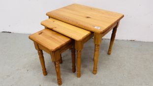 NEST OF THREE GRADUATED PINE TABLES.