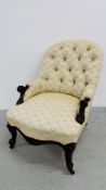 A VICTORIAN MAHOGANY BUTTON BACK NURSING CHAIR WITH SERPENTNE SEAT.