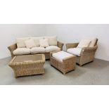 A MODERN CANE CONSERVATORY SUITE COMPRISING OF A THREE SEATER SOFA, AN ARMCHAIR,