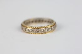 AN 18CT GOLD STONE SET ETERNITY RING.