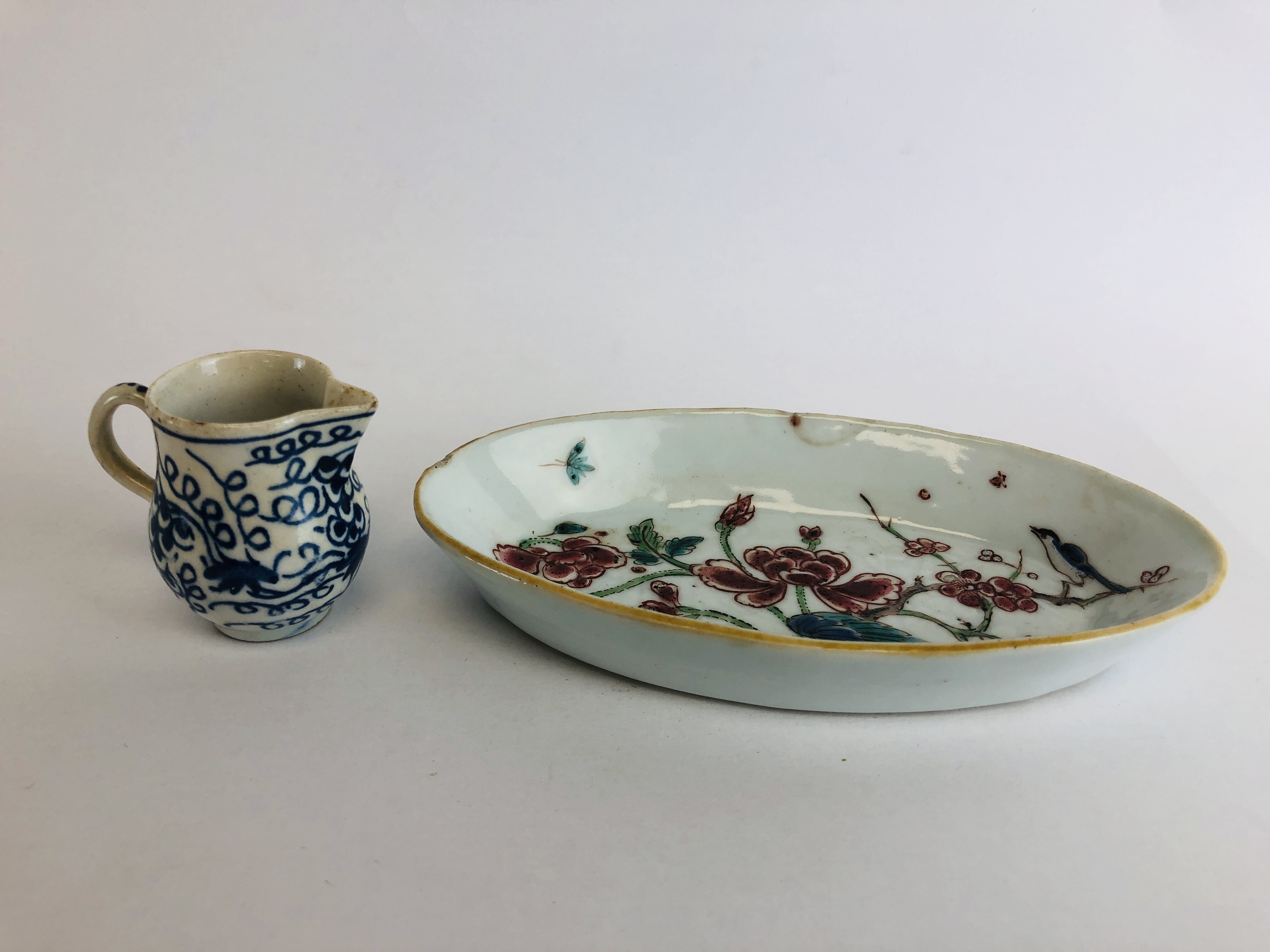 A BOW BLUE AND WHITE MINIATURE MILK JUG H 4CM ALONG WITH A CHINESE QIAN LONG OVAL SPOON TRAY L 13.