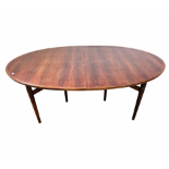 A VINTAGE MID CENTURY ROSEWOOD FINISH MANUFACTURED BY SIBAST FURNITURE DENMARK EXTENDING DINING