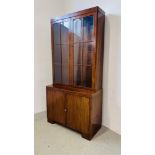 A 1930'S TWO DOOR MAHOGANY BOOKCASE ON CUPBOARD BASE - W 92CM. D 40CM. H 184CM.