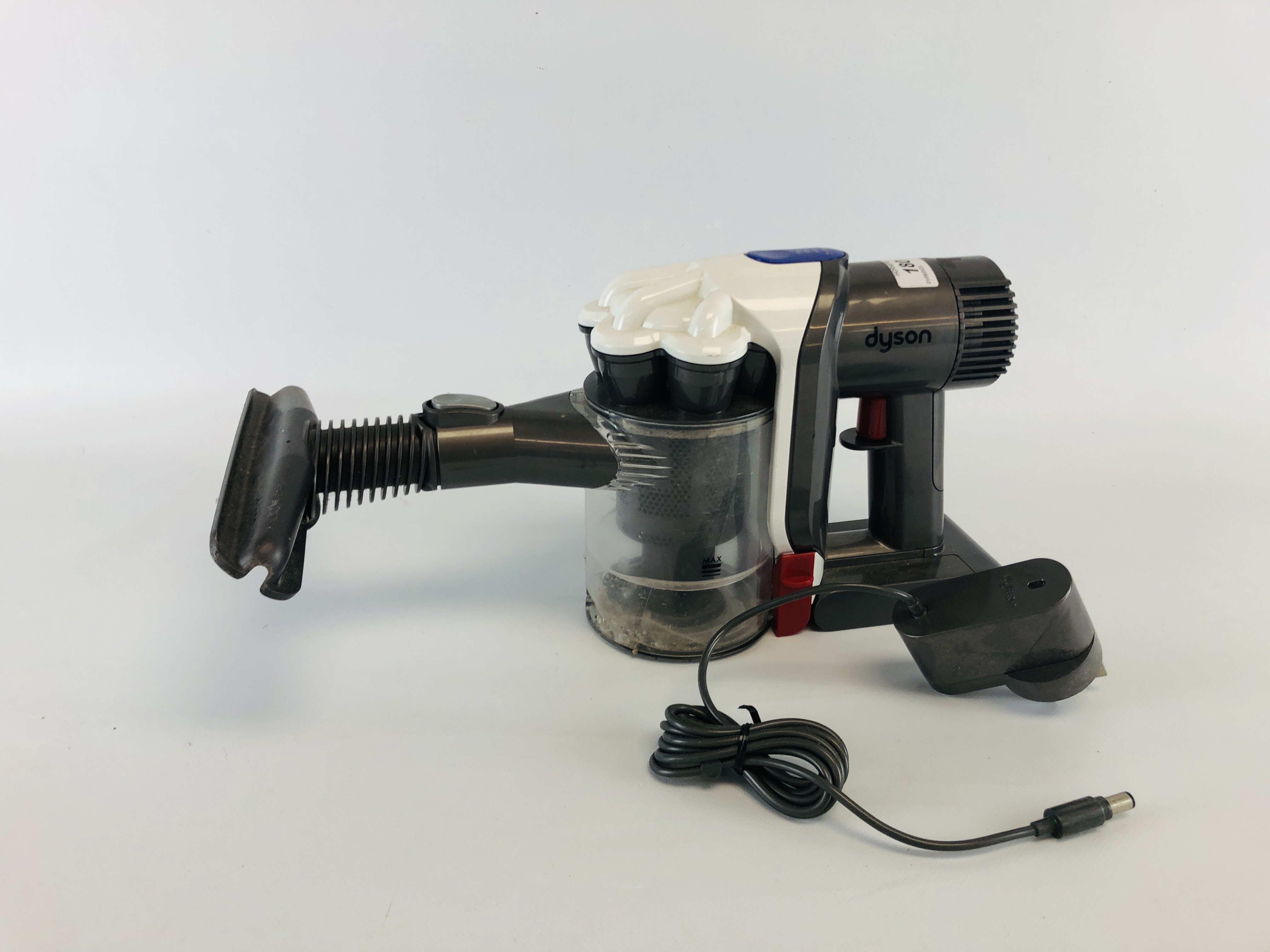 A CORDLESS DYSON DC30 HAND HELD VACUUM CLEANER COMPLETE WITH CHARGER - SOLD AS SEEN.