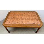 A LARGE OAK COFFEE TABLE WITH COPPER BLOCK WOOD EFFECT INSERT TO TOP BEARING ULFERTS LABEL,