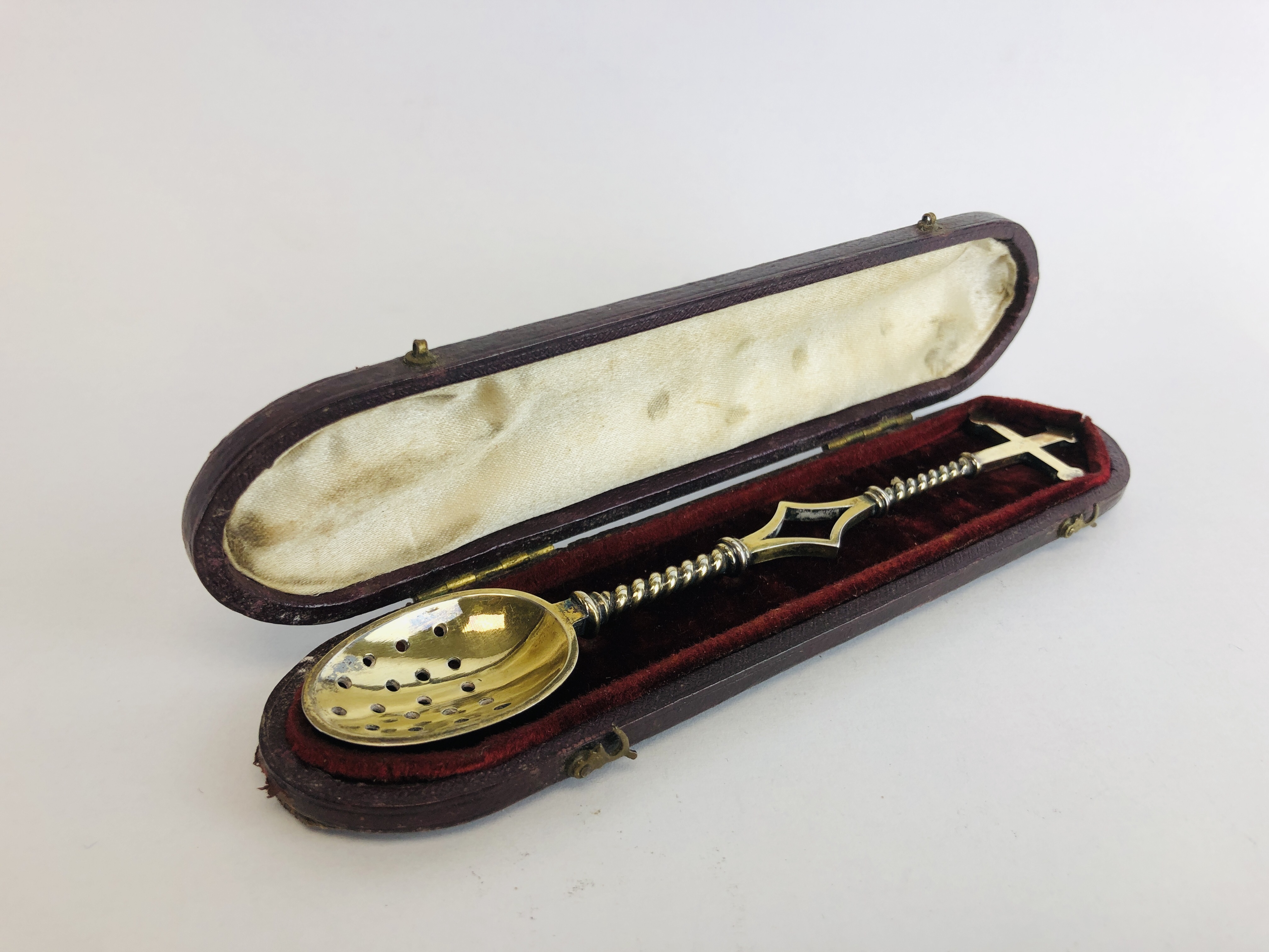 A VICTORIAN SILVER GILT CHRISM SPOON,