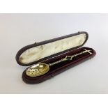 A VICTORIAN SILVER GILT CHRISM SPOON,