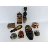 A BOX OF ETHNIC AND TRIBAL CARVINGS TO INCLUDE FACE MASKS.