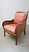 A REPRODUCTION BERGERE WORK ARMCHAIR WITH CUSHIONS.