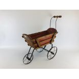A VINTAGE IRON AND WOODEN CRAFTED LEATHER INTERIOR DOLLS PRAM - COLLECTORS ITEM ONLY.