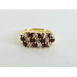 AN 18CT GOLD DIAMOND AND RUBY RING.