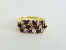 AN 18CT GOLD DIAMOND AND RUBY RING.