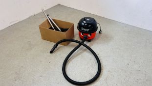 A PNEUMATIC HENRY HOOVER ALONG WITH VARIOUS NOZZLES AND BAGS - SOLD AS SEEN.