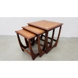 A NEST OF THREE G PLAN TEAK RETRO COFFEE TABLES.