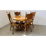 A MODERN HARDWOOD SINGLE PEDESTAL CIRCULAR EXTENDING DINING TABLE AND FOUR MATCHING DINING CHAIRS