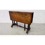 AN ANTIQUE MAHOGANY DROP FLAP TABLE WITH CARVED TWISTED SUPPORTS ON CASTERS.
