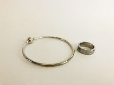 A DESIGNER SILVER BRACELET MARKED PANDORA ALONG WITH A DESIGNER STEEL RING MARKED GUESS.