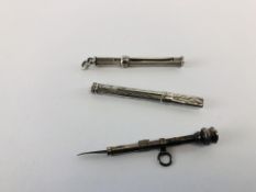 A GROUP OF THREE ANTIQUE SILVER RETRACTABLE TOOTHPICKS.