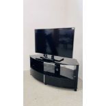 SAMSUNG 37 INCH TELEVISION MODEL UE37ES5500 ALONG WITH A MODERN DESIGNER CURVED BLACK GLASS