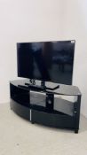 SAMSUNG 37 INCH TELEVISION MODEL UE37ES5500 ALONG WITH A MODERN DESIGNER CURVED BLACK GLASS