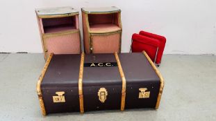 A VINTAGE REFURBISHED BOUND TRAVEL TRUNK, A LILAC BEDTHROW AND TWO 1950's WOVEN BEDSIDE CABINETS.