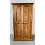 A GOOD QUALITY WAXED PINE TWO DOOR WARDROBE, W 108CM, D 60CM, H 196CM.