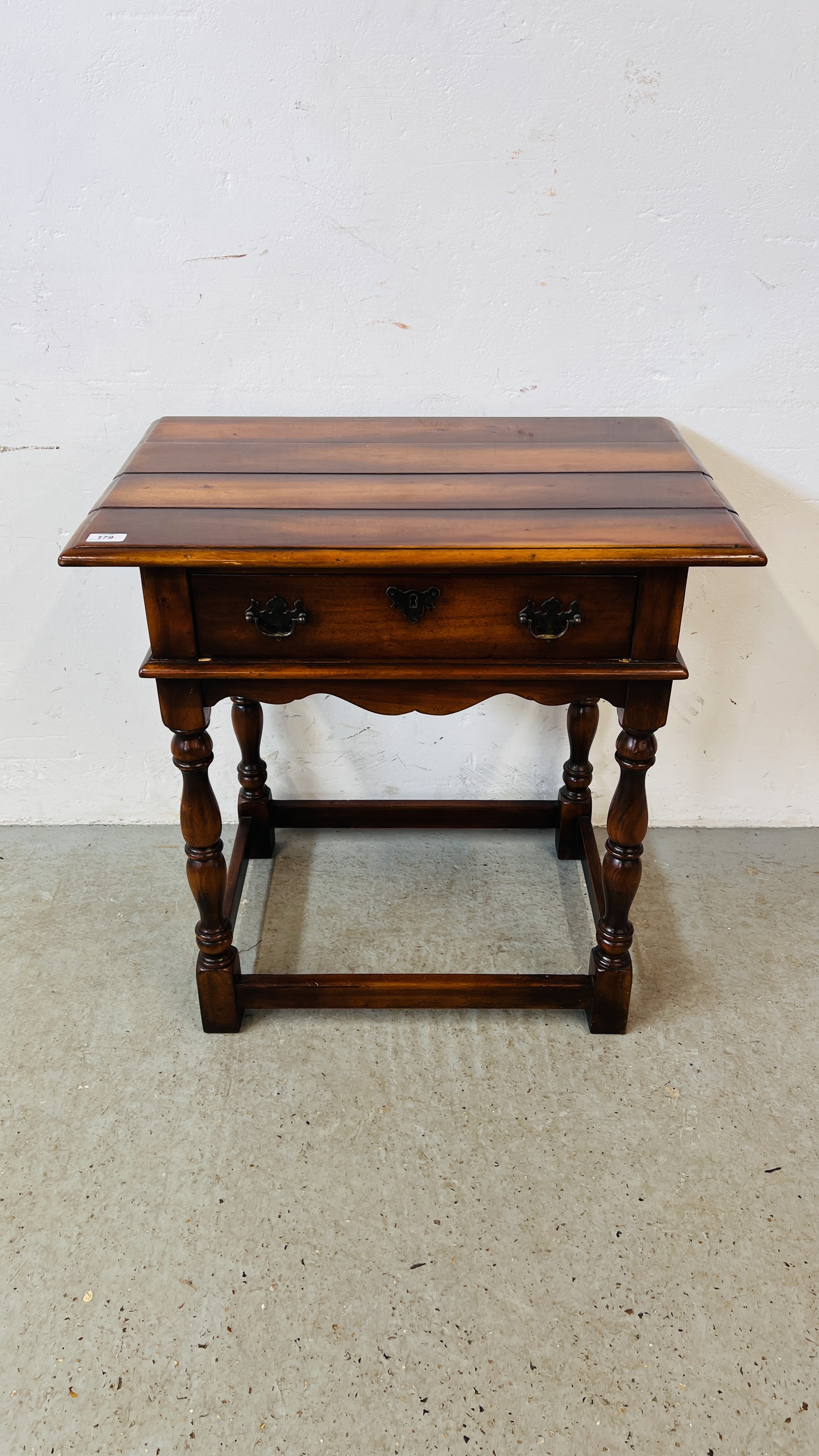 A GOOD QUALITY REPRODUCTION HARDWOOD SINGLE DRAWER SIDE TABLE W 73CM. D 49CM. H 73CM.