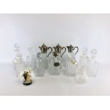 A COLLECTION OF NINE GLASS AND CRYSTAL GLASS DECANTERS AND THREE CLARET JUGS.