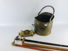 A VINTAGE BRASS COAL SCUTTLE ALONG WITH A BRASS DESK TIDY / INK WELL AND 3 WALKING STICKS.