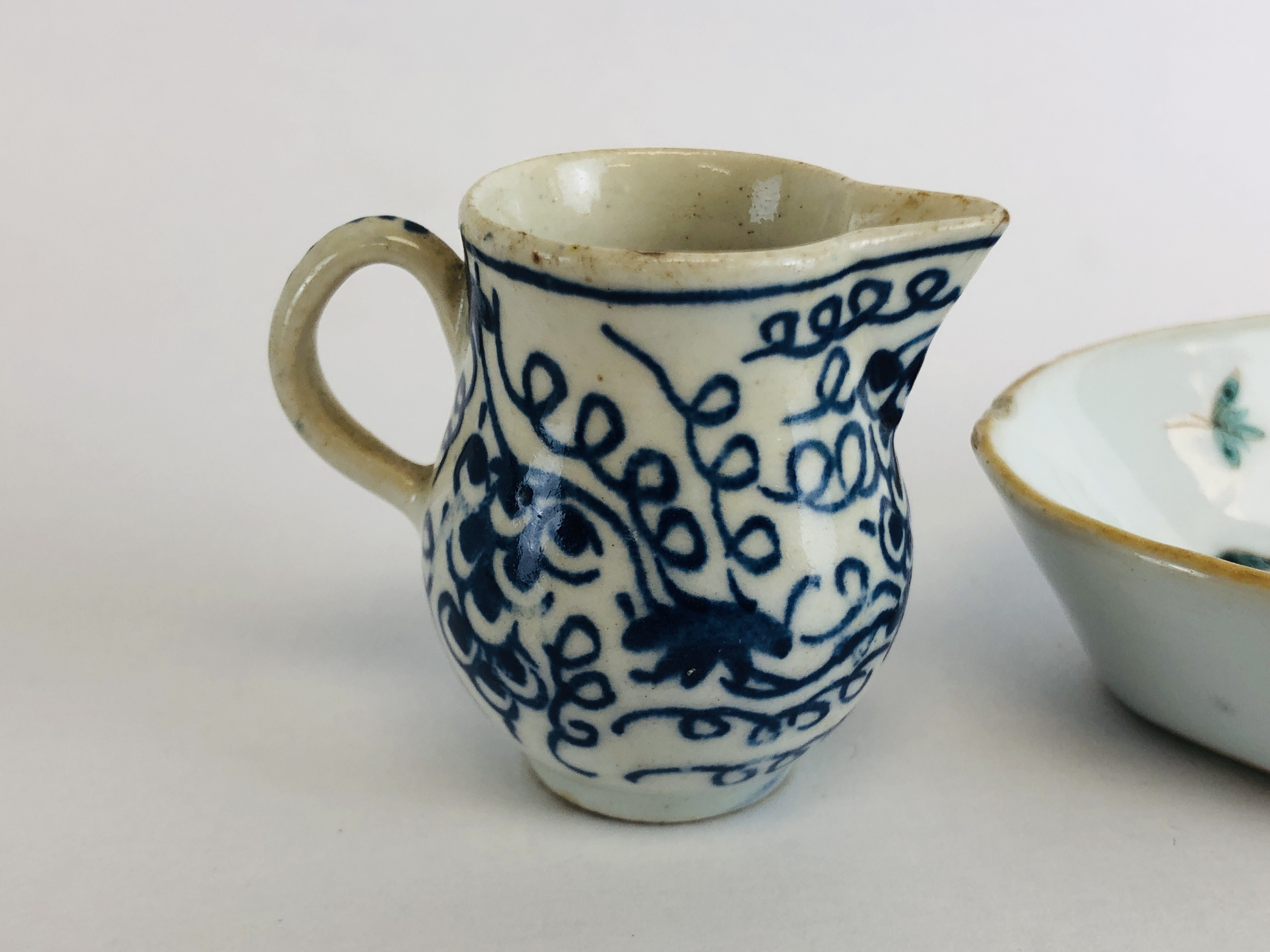 A BOW BLUE AND WHITE MINIATURE MILK JUG H 4CM ALONG WITH A CHINESE QIAN LONG OVAL SPOON TRAY L 13. - Image 6 of 11