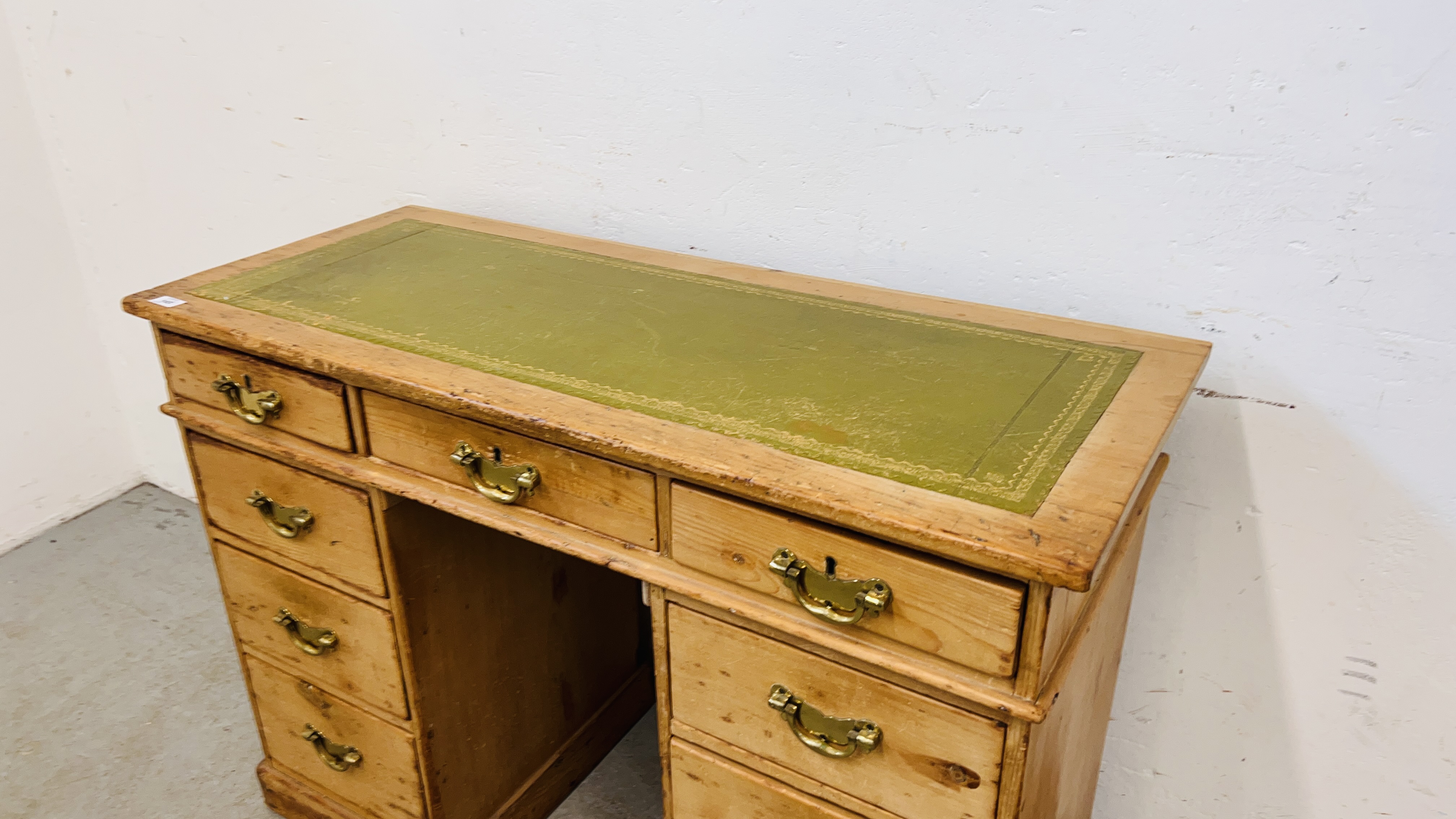 AN ANTIQUE WAXED PINE NINE DRAWER KNEEHOLE DESK WITH TOOLED LEATHER INSET TOP. - Image 3 of 11