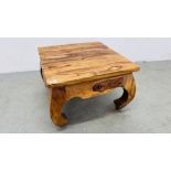 A HARDWOOD DESIGNER OCCASIONAL TABLE 61CM X 60.5CM X 42CM.