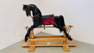 A LARGE CRAFTSMAN MADE ROCKING HORSE "BLACK BEAUTY" A/F HEIGHT TO TOP OF EARS 116CM. LENGTH 154CM.