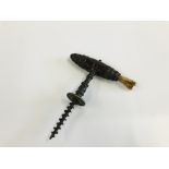 AN ANTIQUE CORKSCREW WITH BRUSH TOP.