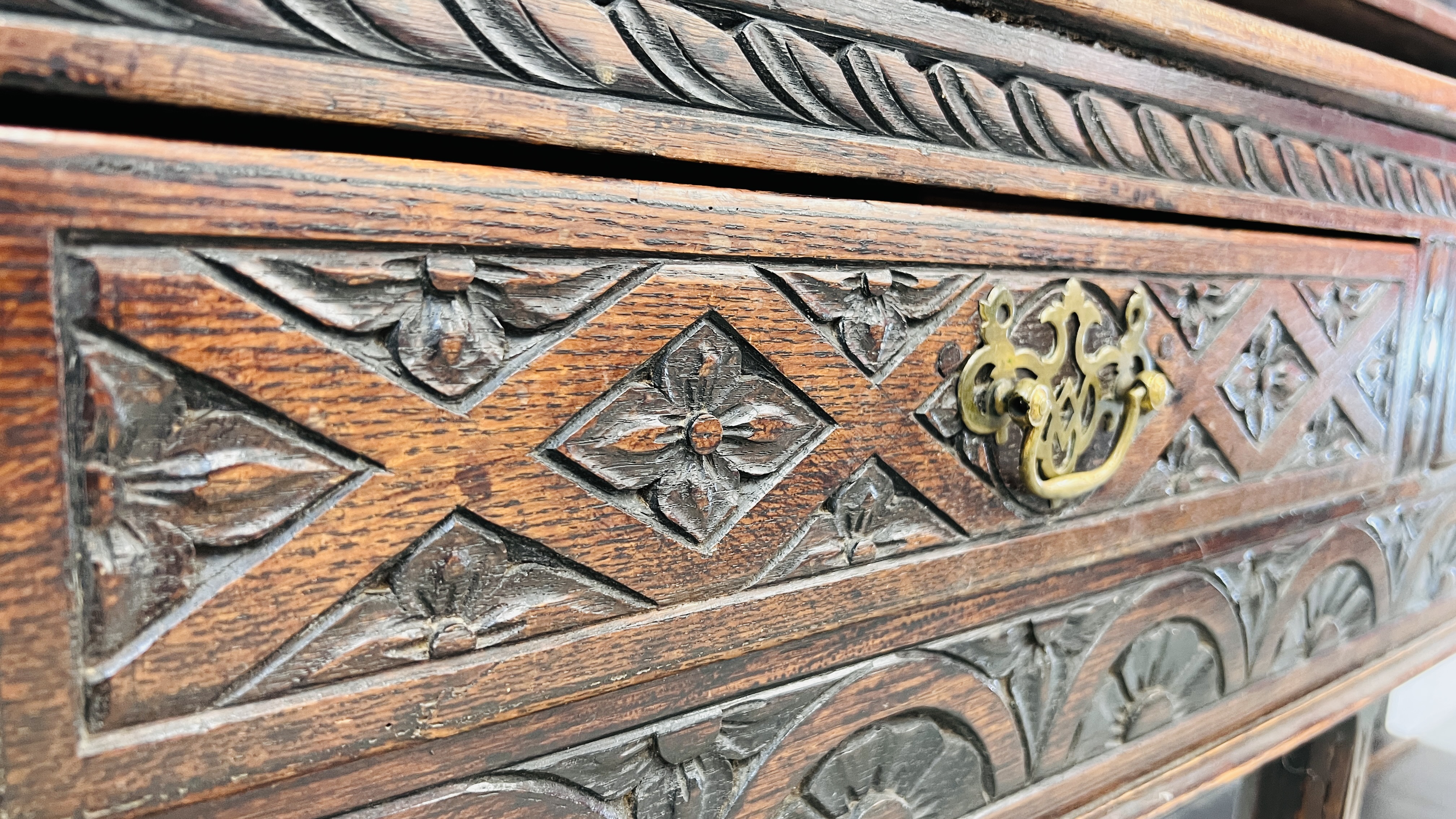 AN EARLY HEAVILY CARVED THREE DRAWER DRESSER BASE WITH ASSOCIATED DRESSER BACK, WIDTH 180CM. - Image 6 of 16