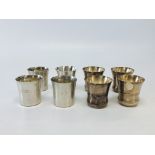 A SET OF FIVE CONTINENTAL WHITE METAL CUPS OF INVERTED BELL SHAPE DECORATED DANCING FIGURES BETWEEN