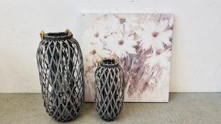 TWO GRADUATED DESIGNER WICKER CRAFT CANDLE HOLDERS THE LARGEST HEIGHT 74CM ALONG WITH A MODERN