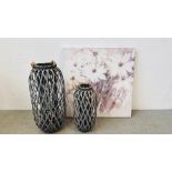 TWO GRADUATED DESIGNER WICKER CRAFT CANDLE HOLDERS THE LARGEST HEIGHT 74CM ALONG WITH A MODERN