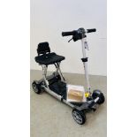 A MOTION M LITE FOLDING COMPACT MOBILITY SCOOTER COMPLETE WITH CHARGER,